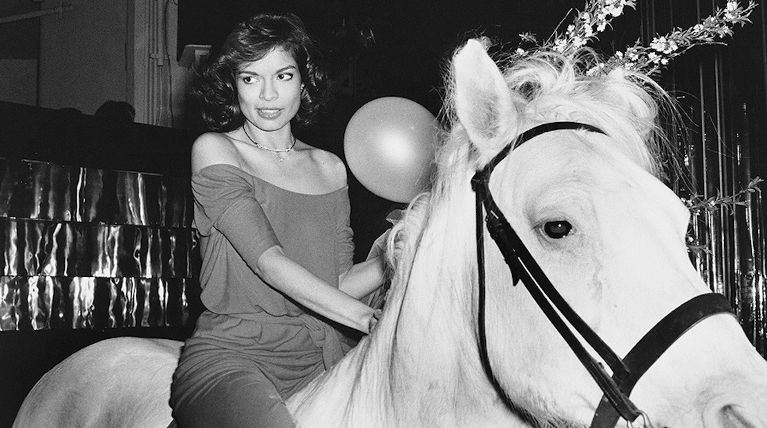 Bianca Jagger on a white horse that happened to be inside Studio 54 on her birthday in 1977. This iconic photo was taken by Rose Hartman, subject of Otis Mass’ documentary The Incomparable Rose Hartman, screening at the 2016 Bentonville Film Festival. PHOTO CREDIT: Rose Hartman / The Artists Company