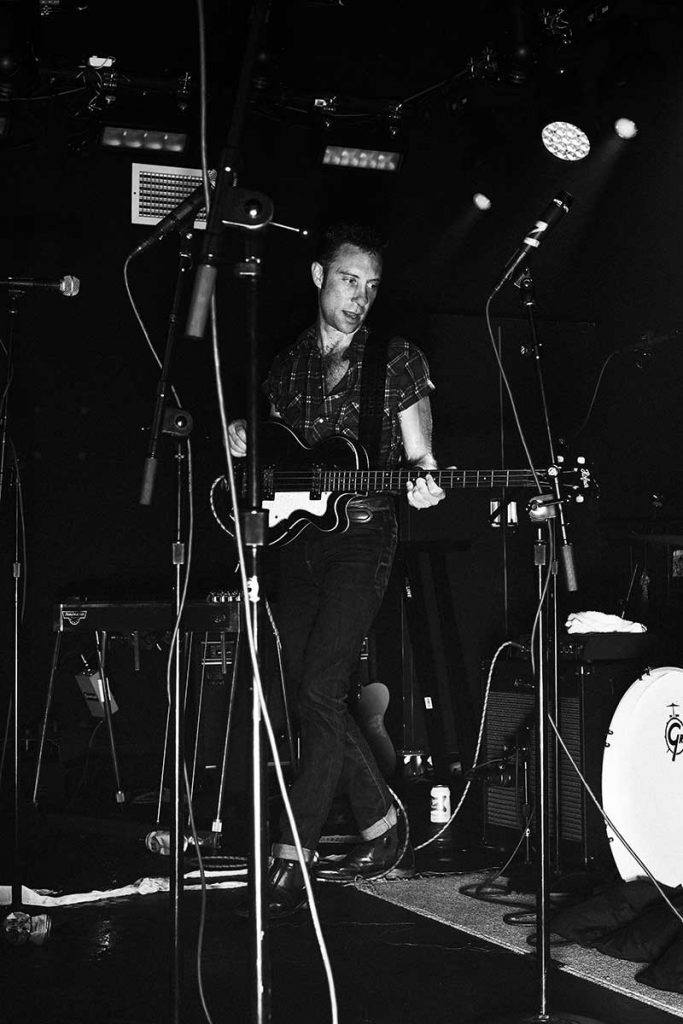 Jared Swilley from Black Lips photographed on stage at TV Eye in New York City by Alexander Thompson for Reserved magazine.