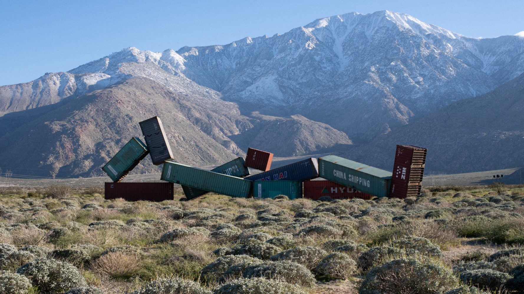 shipping containers posed in the desert 