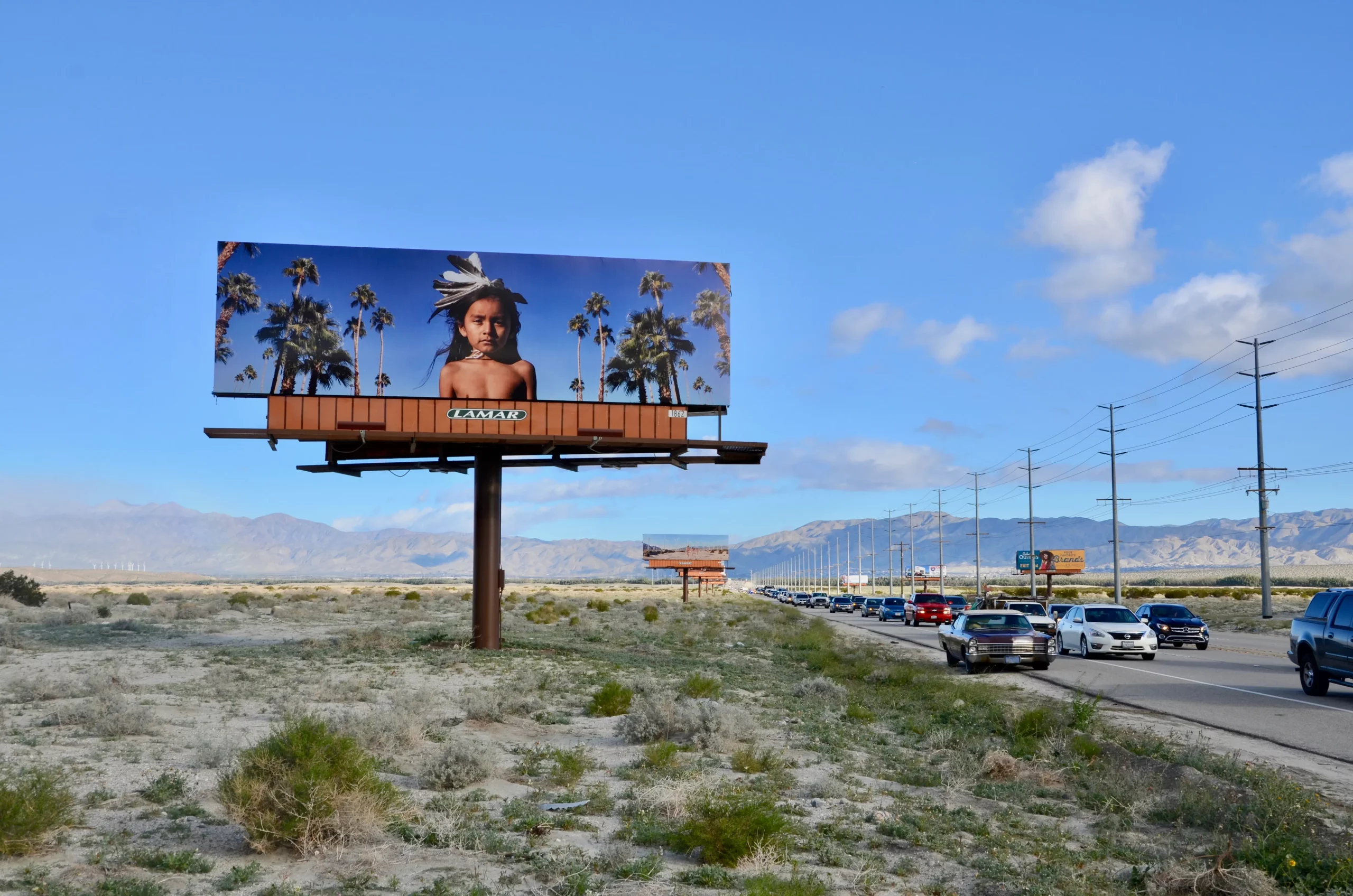 Desert X Closing 2023 billboard sign in the desert palm springs