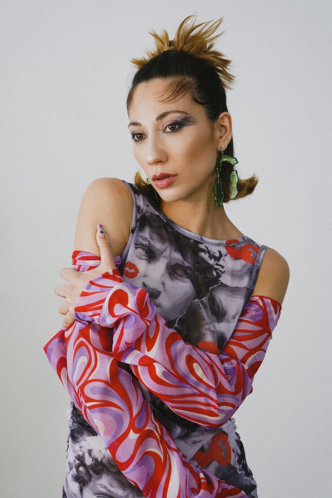 Tei Shi photographed by David Simon Dayan Styled by BJ Panda Bear wears Emily on Holiday dress, Kidill Top, and XXX earrings.
