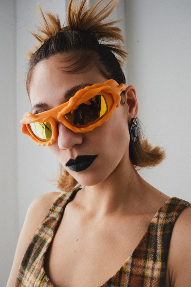 Tei Shi photographed by David Simon Dayan Styled by BJ Panda Bear wears High Rack Studios top, Ottolinger x Gentle Monster glasses and XXX earrings.