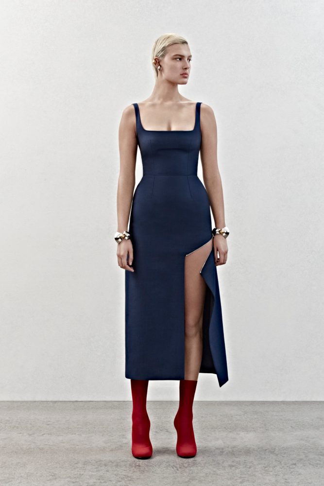 A slashed dress with a square neckline and silver metal zip detailing in ultramarine wool.