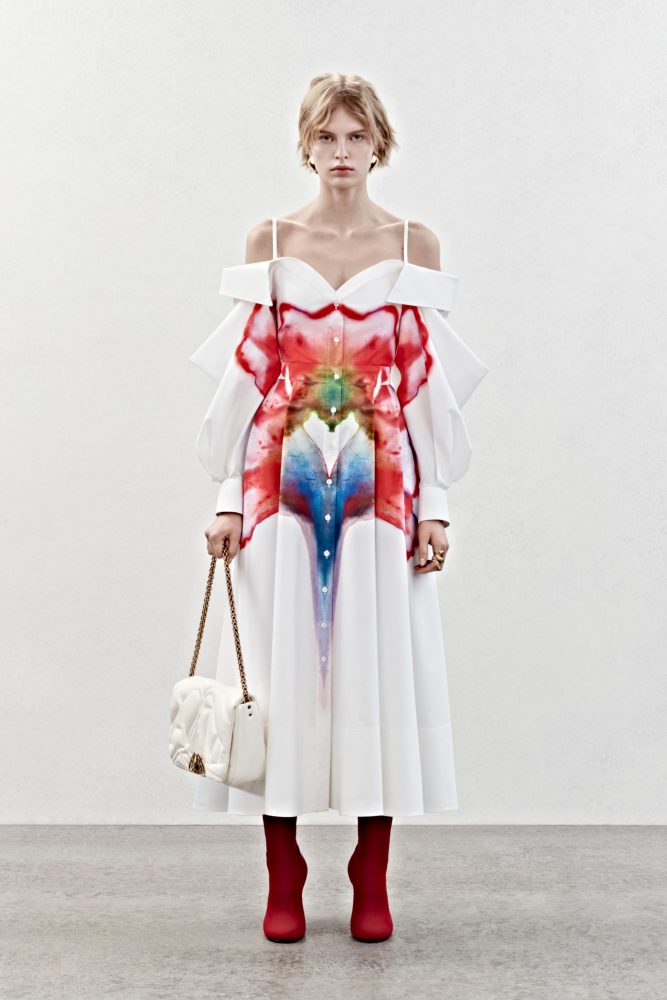 A deconstructed shirt dress in white cotton poplin with a solarized flower print.