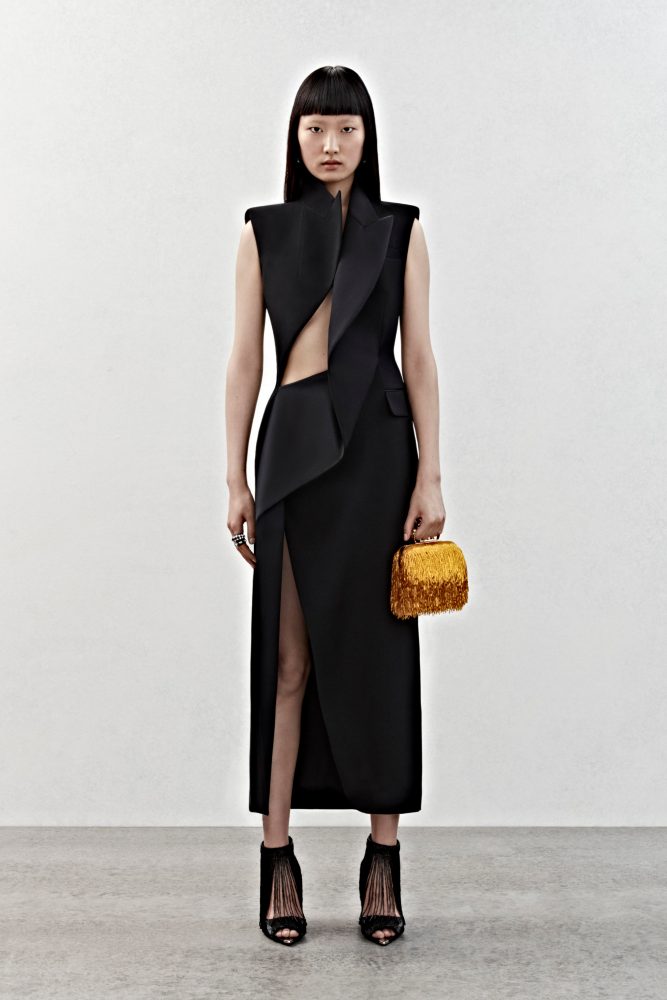 A deconstructed tailored dress in black wool.