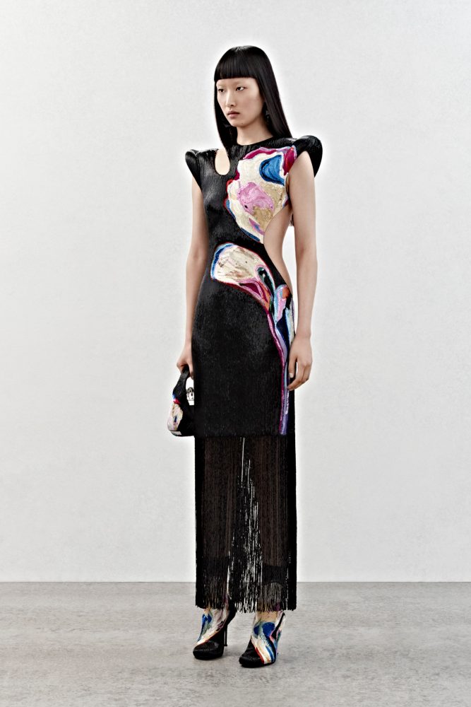 A slashed dress with all-over black and solarized flower bugle bead embroidery and fringing.