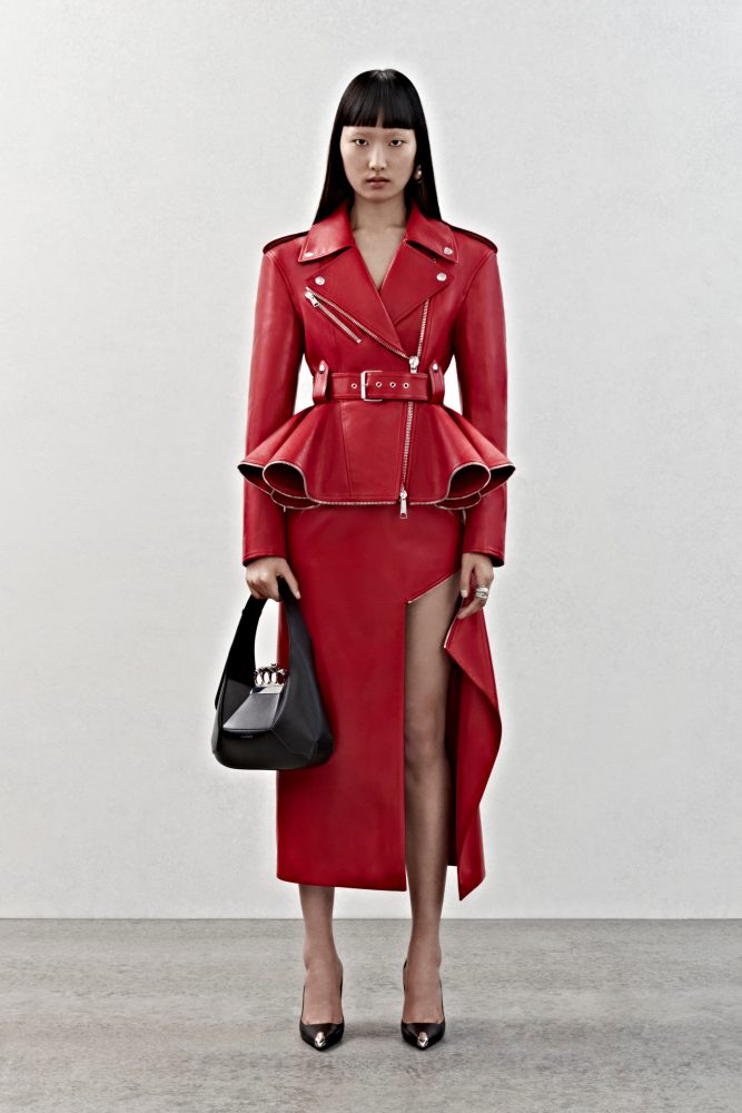 A peplum biker jacket and slashed skirt in red leather.