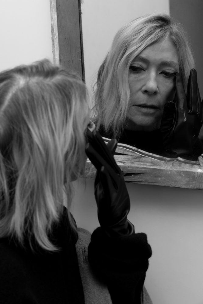 Kim Gordon wears ISSEY MIYAKE dress and gloves. Photographed by Jason Renaud. Styled by BJ Panda Bear and Paul Rizzo. Hair by Paul Rizzo using Bumble and Bumble Makeup by Nicole Servin Joshua Nixon