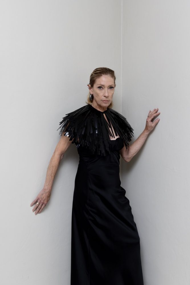 Kim Gordon wears JIL SANDER dress, cape, and jewelry. Photographed by Jason Renaud. Styled by BJ Panda Bear and Paul Rizzo. Hair by Paul Rizzo using Bumble and Bumble Makeup by Nicole Servin Joshua Nixon