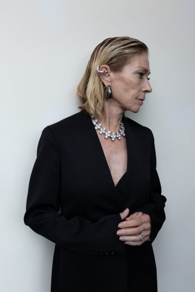Kim Gordon wears JIL SANDER dress, coat, and jewelry. Photographed by Jason Renaud. Styled by BJ Panda Bear and Paul Rizzo. Hair by Paul Rizzo using Bumble and Bumble Makeup by Nicole Servin Joshua Nixon