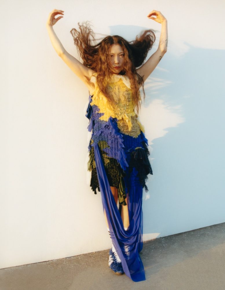 Sasami wears CAROLINE HU dress, CAROLINE HU x ADIDAS ORIGINALS shoes, and ADIDAS socks. Written and Produced by BJ Panda Bear. Photographed by Andrew Friendly. Styled by Britton Litow. Hair: Paul Rizzo using Bumble and Bumble. Makeup: Nichole Servin using Westman Atelier and Rare Beauty. Stylist Assistant: Maddie Collins.