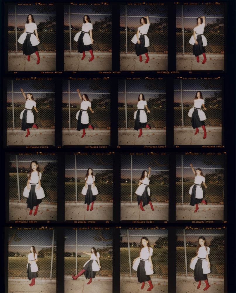 Sasami wears GIVENCHY top available at FWRD, COS skirt, SERPENTI shoes, PYRRHA ring, MENĒ ring, and stylist's own pannier. film multi Written and Produced by BJ Panda Bear. Photographed by Andrew Friendly. Styled by Britton Litow. Hair: Paul Rizzo using Bumble and Bumble. Makeup: Nichole Servin using Westman Atelier and Rare Beauty. Stylist Assistant: Maddie Collins.