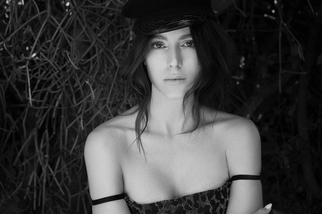 Tatiana Luter wears DOLCE & GABBANA dress and GAULTIER hat available at the Archive x Yana BW 2