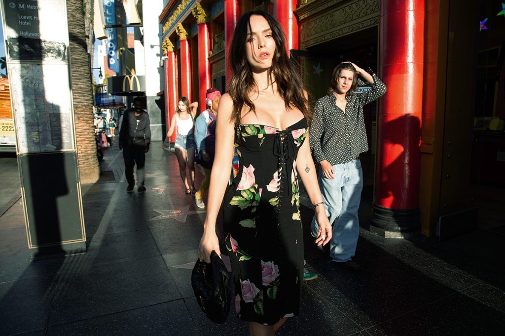 Tatiana Luter wears DOLCE & GABBANA coat and SAINT LAURENT BY ANTHONY VACCARELLO bag