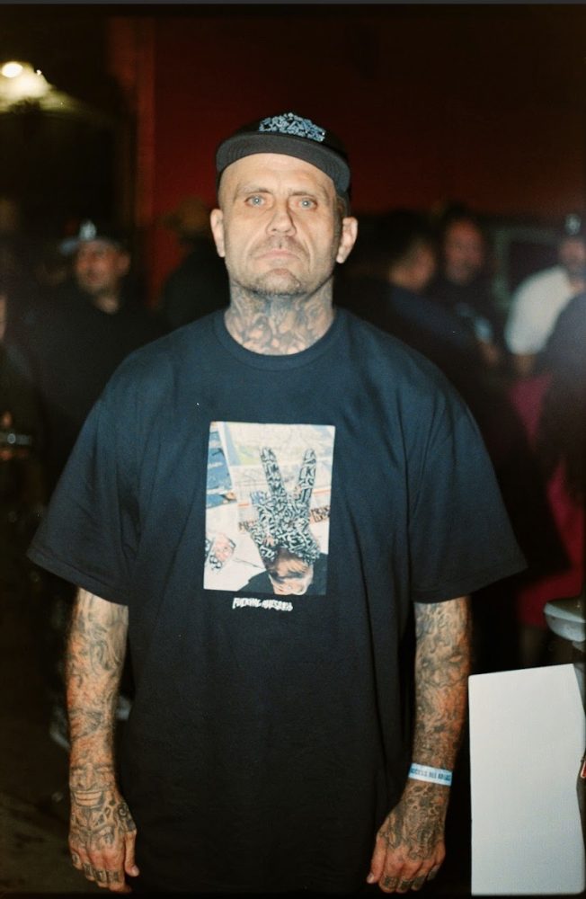 Dead City Punx Take Back LA Still from Punx: The Art of Dead City and Friends. black tee tattoo