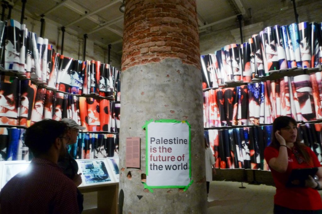 VENICE ART BIENNALE DIARY with Artist Jenny Sharaf The poster phrase “Palestine is the future of the world” is drawn from a work by Alfredo Jaar, whose politically engaged practice frequently addresses state violence, displacement, and the ethics of representation. The slogan appeared throughout the 61st Venice Biennale during a series of artist-led solidarity actions and protests connected to Gaza and broader debates around cultural institutions and political accountability.