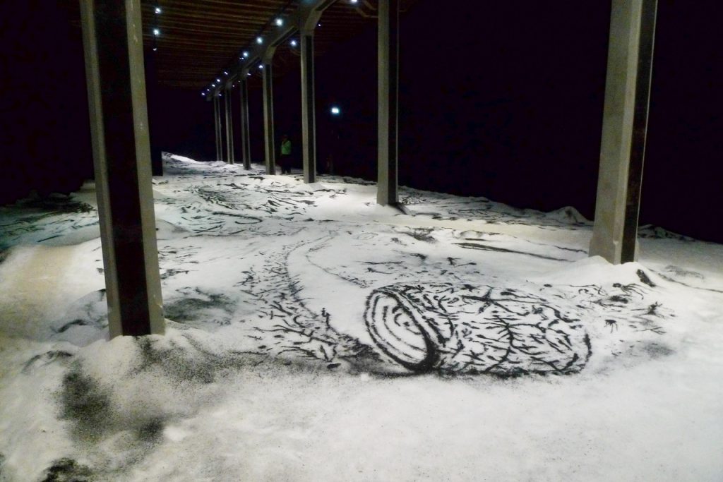 VENICE ART BIENNALE DIARY with Artist Jenny Sharaf Argentinian artist Matías Duville transforms the pavilion into a haunting, erosion-like landscape composed of charcoal and salt — materials associated with combustion, decay, and geological time. This installation worked on all levels.